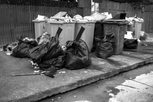 Workers managing demolition waste at a construction site in Bromley